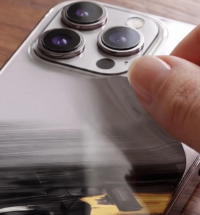 A SUBUMI skin being applied, showing how thin the vinyl is
